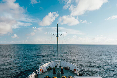 The E/V Nautilus approaching Swains Island