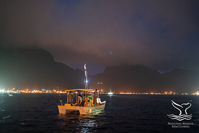 A fishing boat at night